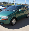 chevrolet aveo 2004 green hatchback ls gasoline 4 cylinders front wheel drive automatic with overdrive 76108