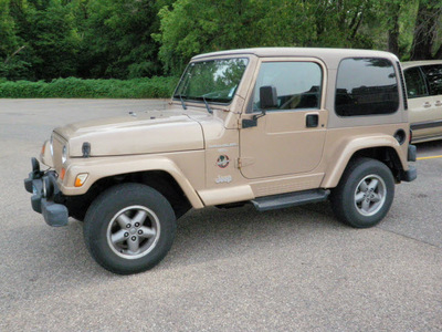 jeep wrangler 1999 lt  brown suv sahara gasoline 6 cylinders 4 wheel drive 5 speed manual 55318