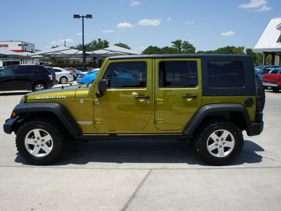 jeep wrangler unlimited 2010 green suv rubicon gasoline 6 cylinders 4 wheel drive 6 speed manual 76087