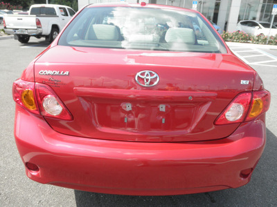 toyota corolla 2009 red sedan le 4 cylinders automatic 34788