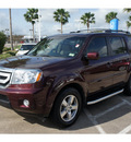 honda pilot 2009 dk  red suv ex l w dvd gasoline 6 cylinders front wheel drive automatic 77566
