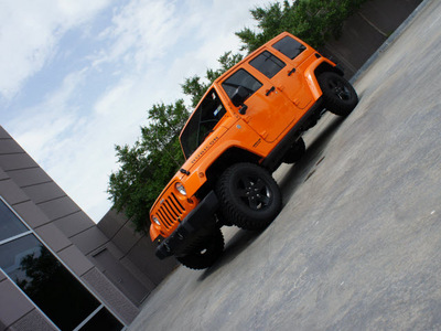 jeep wrangler unlimited 2012 orange suv rubicon gasoline 6 cylinders 4 wheel drive automatic 76108