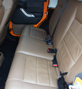 jeep wrangler unlimited 2012 orange suv rubicon gasoline 6 cylinders 4 wheel drive automatic 76108