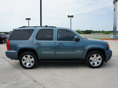 gmc yukon 2009 blue suv slt 8 cylinders automatic 76087