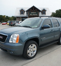 gmc yukon 2009 blue suv slt 8 cylinders automatic 76087