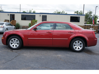 chrysler 300 2007 red sedan touring gasoline 6 cylinders rear wheel drive automatic 77088