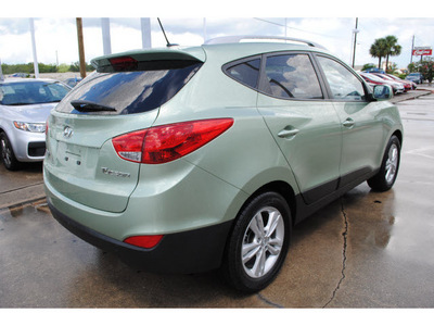 hyundai tucson 2010 green suv gasoline 4 cylinders front wheel drive automatic with overdrive 77598