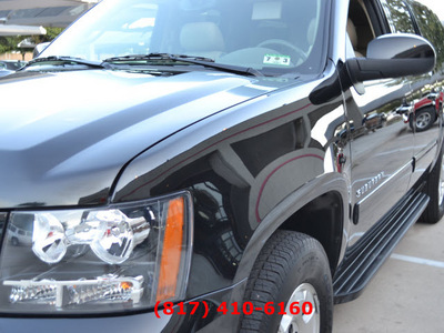 chevrolet suburban 2012 black suv lt 1500 w dvd flex fuel 8 cylinders 4 wheel drive automatic 76051