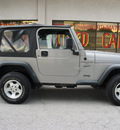 jeep wrangler 2001 silver suv sport gasoline 6 cylinders 4 wheel drive automatic with overdrive 75080