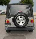 jeep wrangler 2001 silver suv sport gasoline 6 cylinders 4 wheel drive automatic with overdrive 75080