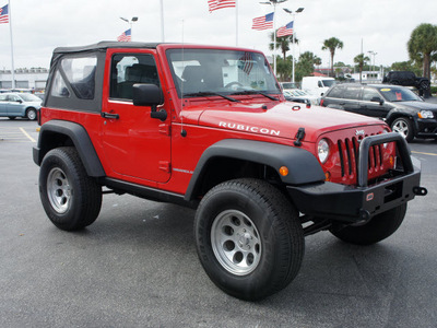 jeep wrangler 2010 red suv rubicon gasoline 6 cylinders 4 wheel drive 6 speed manual 33021