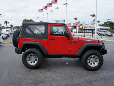 jeep wrangler 2010 red suv rubicon gasoline 6 cylinders 4 wheel drive 6 speed manual 33021