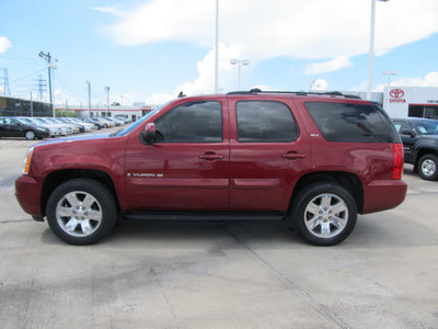 gmc yukon 2009 dk  red suv slt xfe flex fuel 8 cylinders 2 wheel drive automatic with overdrive 77469