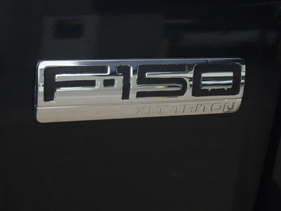 ford f 150 2005 black xlt gasoline 8 cylinders rear wheel drive automatic 77521