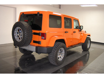 jeep wrangler unlimited 2012 orange suv sahara gasoline 6 cylinders 4 wheel drive automatic with overdrive 77630
