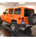 jeep wrangler unlimited 2012 orange suv sahara gasoline 6 cylinders 4 wheel drive automatic with overdrive 77630