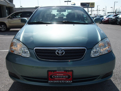 toyota corolla 2006 lt  green sedan le gasoline 4 cylinders front wheel drive automatic with overdrive 76011
