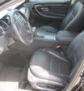ford taurus 2011 black sedan gasoline 6 cylinders front wheel drive automatic 77578
