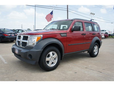 dodge nitro 2007 red suv sxt gasoline 6 cylinders rear wheel drive automatic 77034
