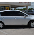 nissan versa 2010 silver hatchback 1 8 s gasoline 4 cylinders front wheel drive automatic 78233