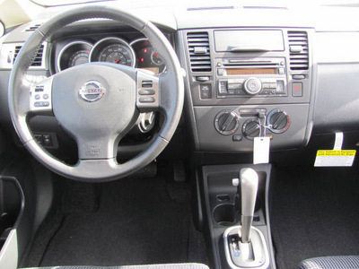 nissan versa 2012 silver hatchback sl gasoline 4 cylinders front wheel drive automatic 33884