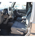jeep wrangler 2011 black suv sport gasoline 6 cylinders 4 wheel drive 6 speed manual 77065