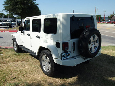 jeep wrangler unlimited 2010 white suv sahara gasoline 6 cylinders 4 wheel drive automatic 75067