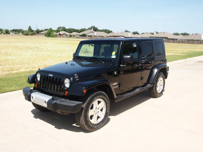 jeep wrangler unlimited 2009 black suv sahara gasoline 6 cylinders 4 wheel drive automatic 76049