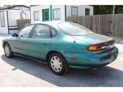 ford taurus 1997 green sedan gl gasoline v6 front wheel drive automatic 77070