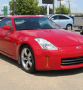 nissan 350z 2006 red coupe gasoline 6 cylinders rear wheel drive 6 speed manual 77074