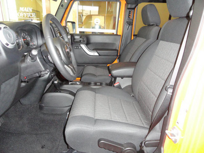 jeep wrangler unlimited 2012 orange suv sahara gasoline 6 cylinders 4 wheel drive automatic 60915