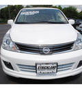 nissan versa 2011 white hatchback gasoline 4 cylinders front wheel drive automatic with overdrive 77581