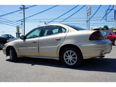 pontiac grand am 2002 brown sedan se gasoline 4 cylinders front wheel drive automatic 78654