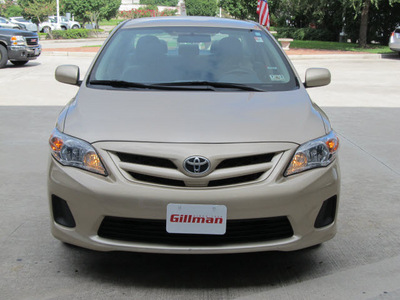 toyota corolla 2011 tan sedan le gasoline 4 cylinders front wheel drive automatic with overdrive 77090