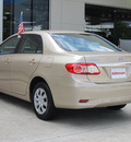 toyota corolla 2011 tan sedan le gasoline 4 cylinders front wheel drive automatic with overdrive 77090