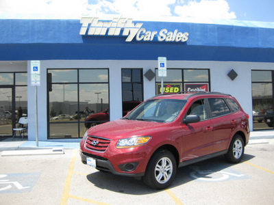 hyundai santa fe 2011 red gls gasoline 4 cylinders front wheel drive automatic 79936