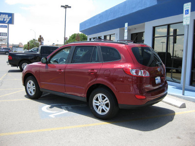 hyundai santa fe 2011 red gls gasoline 4 cylinders front wheel drive automatic 79936