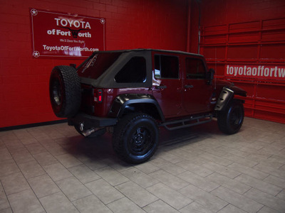 jeep wrangler unlimited 2007 red suv sahara gasoline 6 cylinders 4 wheel drive 6 speed manual 76116