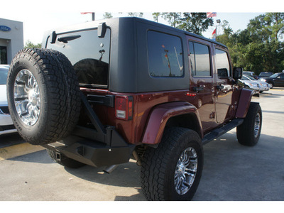 jeep wrangler unlimited 2009 red suv sahara gasoline 6 cylinders 4 wheel drive automatic 77338