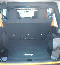 jeep wrangler unlimited 2013 orange suv sport gasoline 6 cylinders 4 wheel drive manual 77388