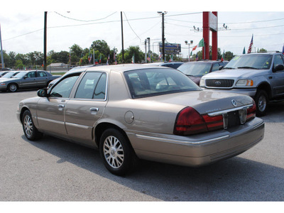 mercury grand marquis 2004 beige sedan ls premium gasoline 8 cylinders rear wheel drive automatic with overdrive 77020