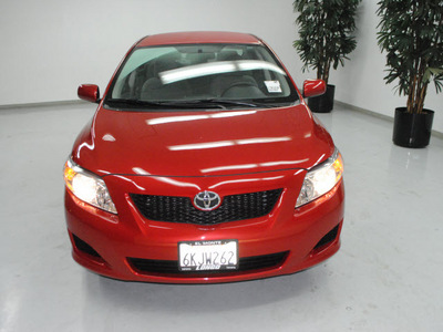 toyota corolla 2010 red sedan le gasoline 4 cylinders front wheel drive automatic 91731