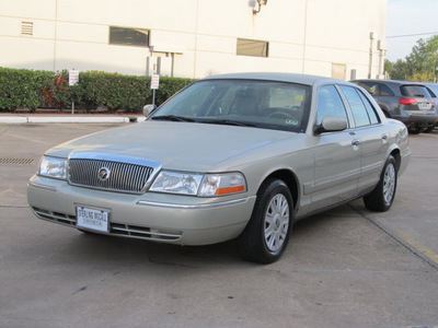 mercury grand marquis 2004 gold sedan gs gasoline 8 cylinders rear wheel drive automatic with overdrive 77074