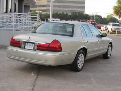 mercury grand marquis 2004 gold sedan gs gasoline 8 cylinders rear wheel drive automatic with overdrive 77074