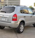 hyundai tucson 2009 silver suv gls gasoline 4 cylinders front wheel drive shiftable automatic 77074