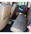 jeep wrangler unlimited 2011 red suv rubicon gasoline 6 cylinders 4 wheel drive automatic with overdrive 77002