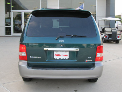 kia sedona 2005 dk  green van ex gasoline 6 cylinders front wheel drive automatic with overdrive 77099