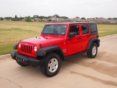 jeep wrangler unlimited 2011 red suv sport gasoline 6 cylinders 4 wheel drive automatic 76049
