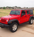 jeep wrangler unlimited 2011 red suv sport gasoline 6 cylinders 4 wheel drive automatic 76049