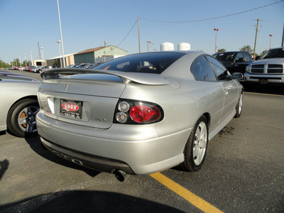 pontiac gto 2006 silver coupe gasoline 8 cylinders rear wheel drive 6 speed manual 60915